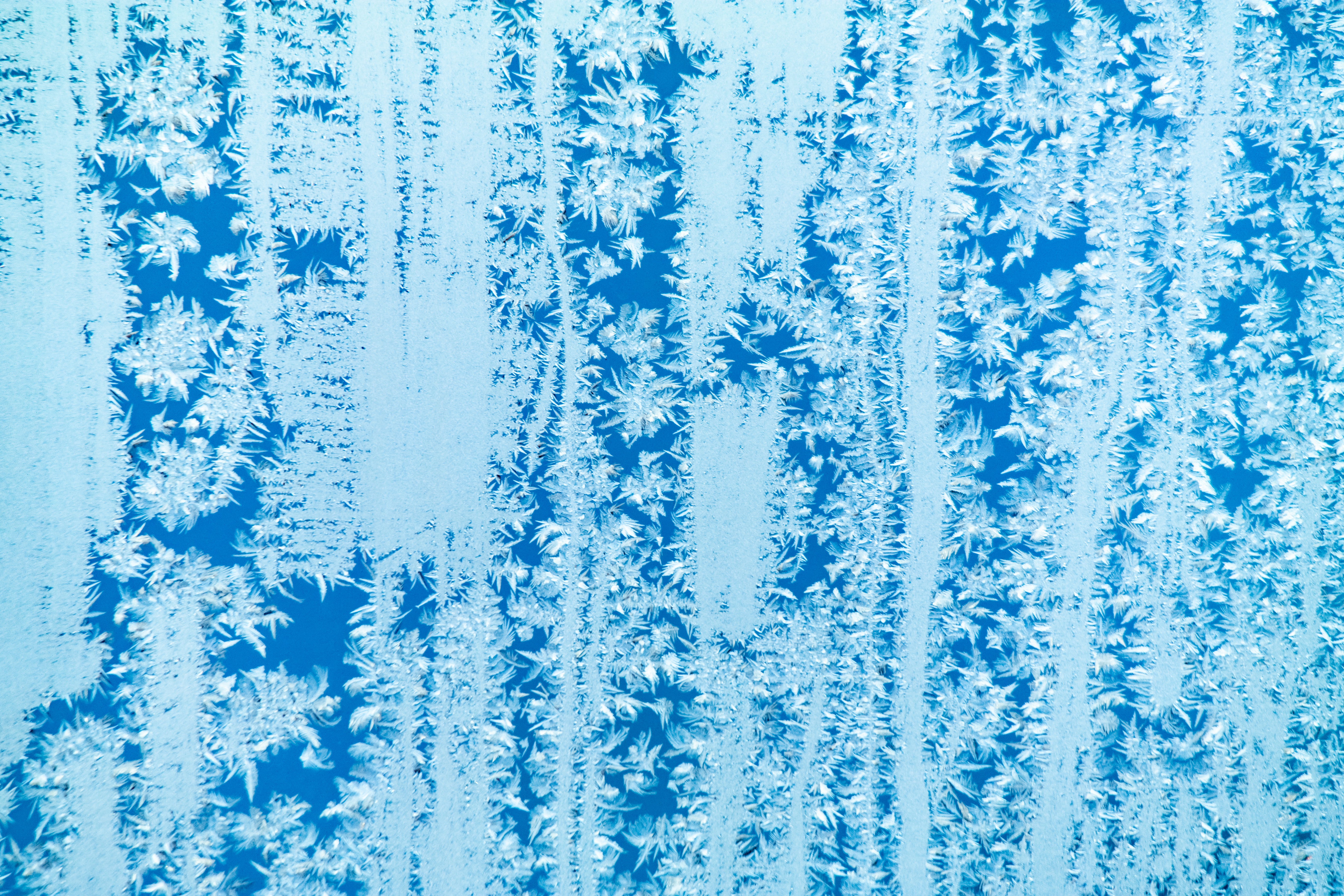 closeup of ice crystals formed on glass, representing a cold storage facility