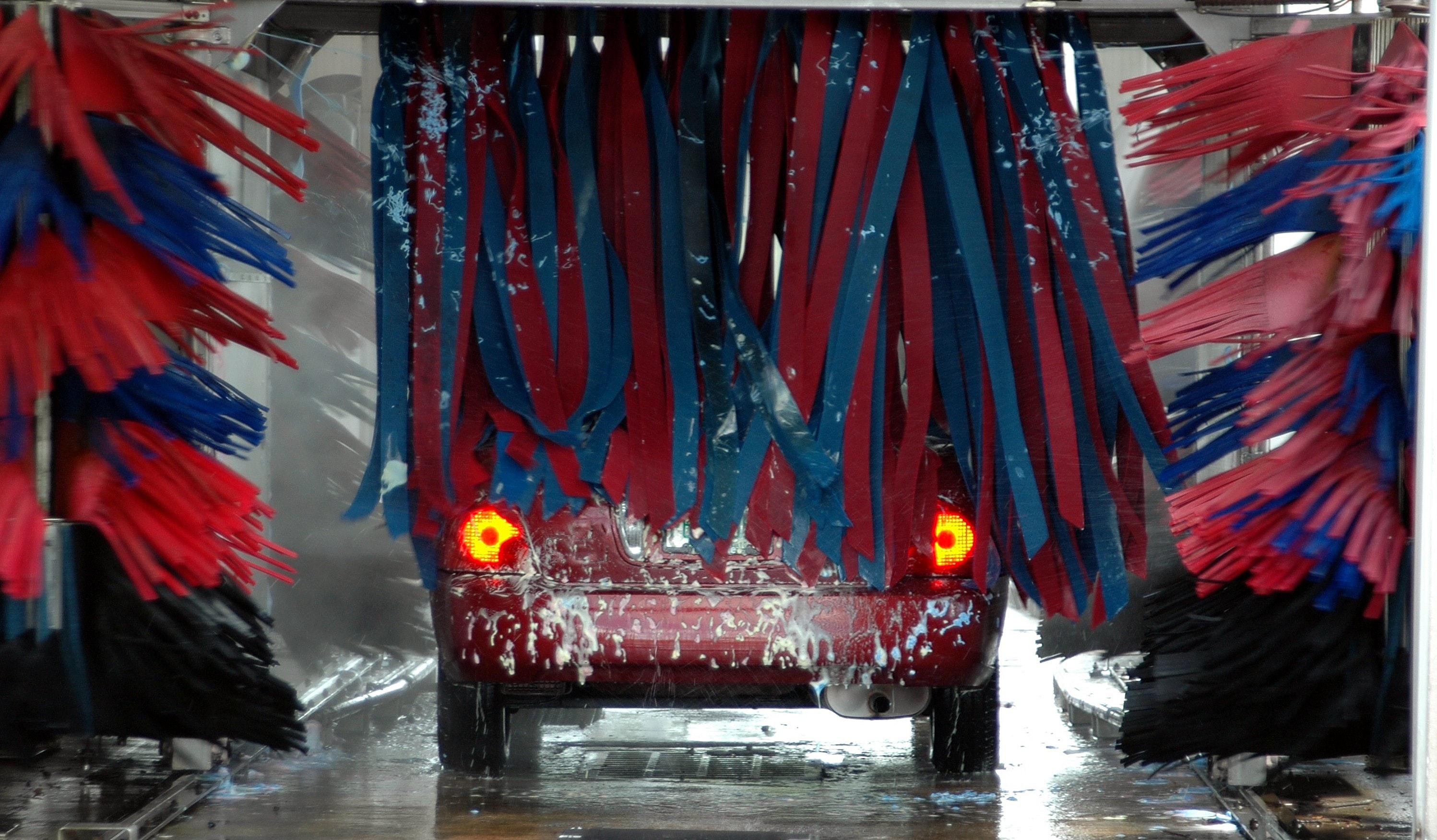 A car in an automatic car wash