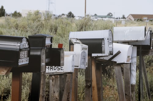 A group of mailboxes by a road representing an defamation action by a postal worker union