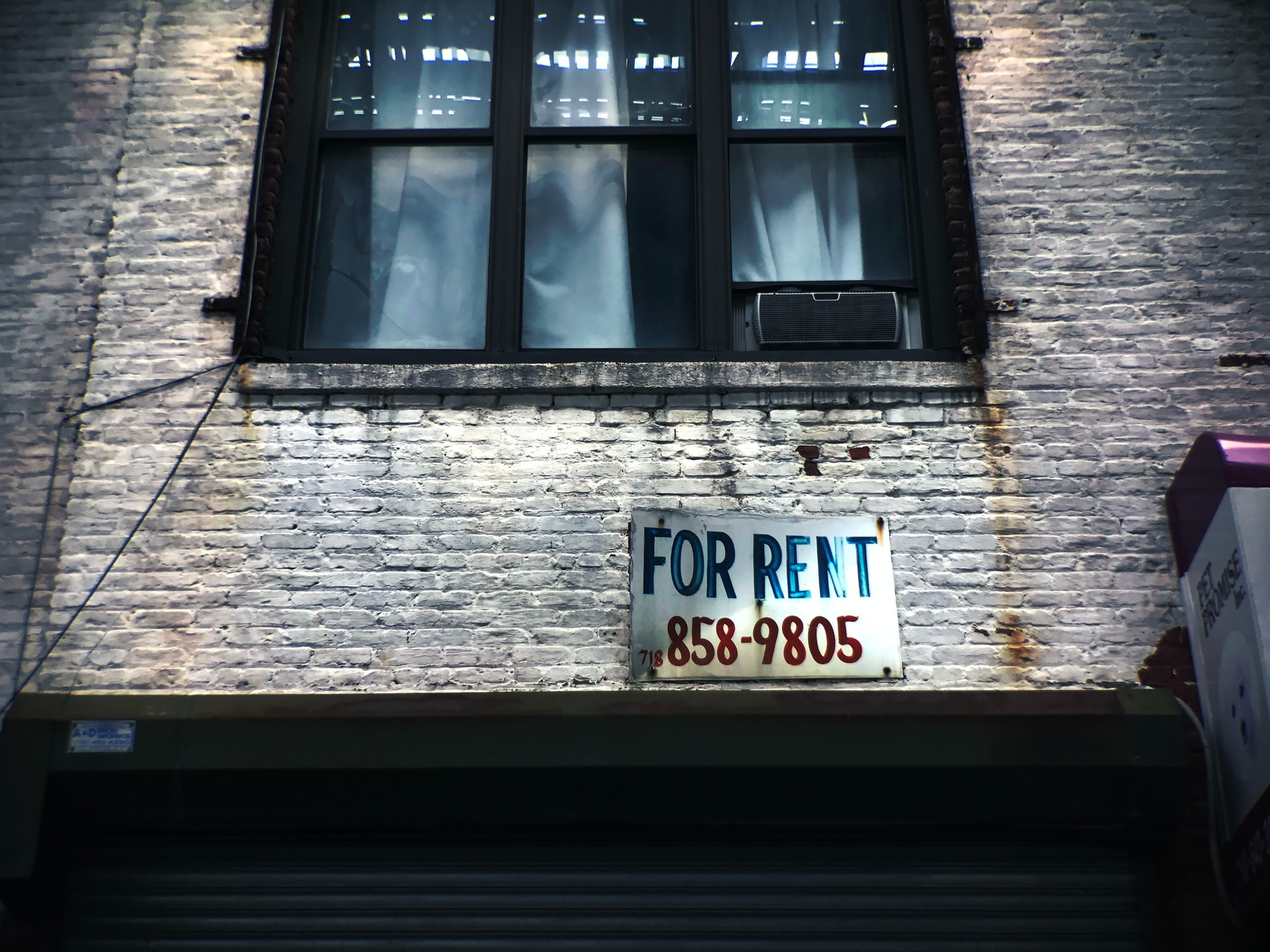 A "for rent" sign indicating a property for lease