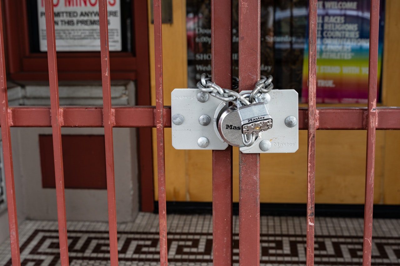 Locked gate in front of business